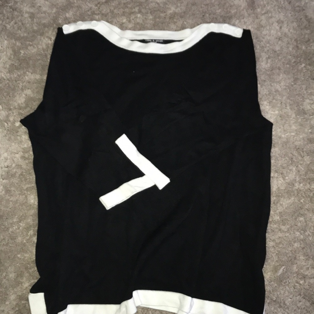 A black tunic with white accents